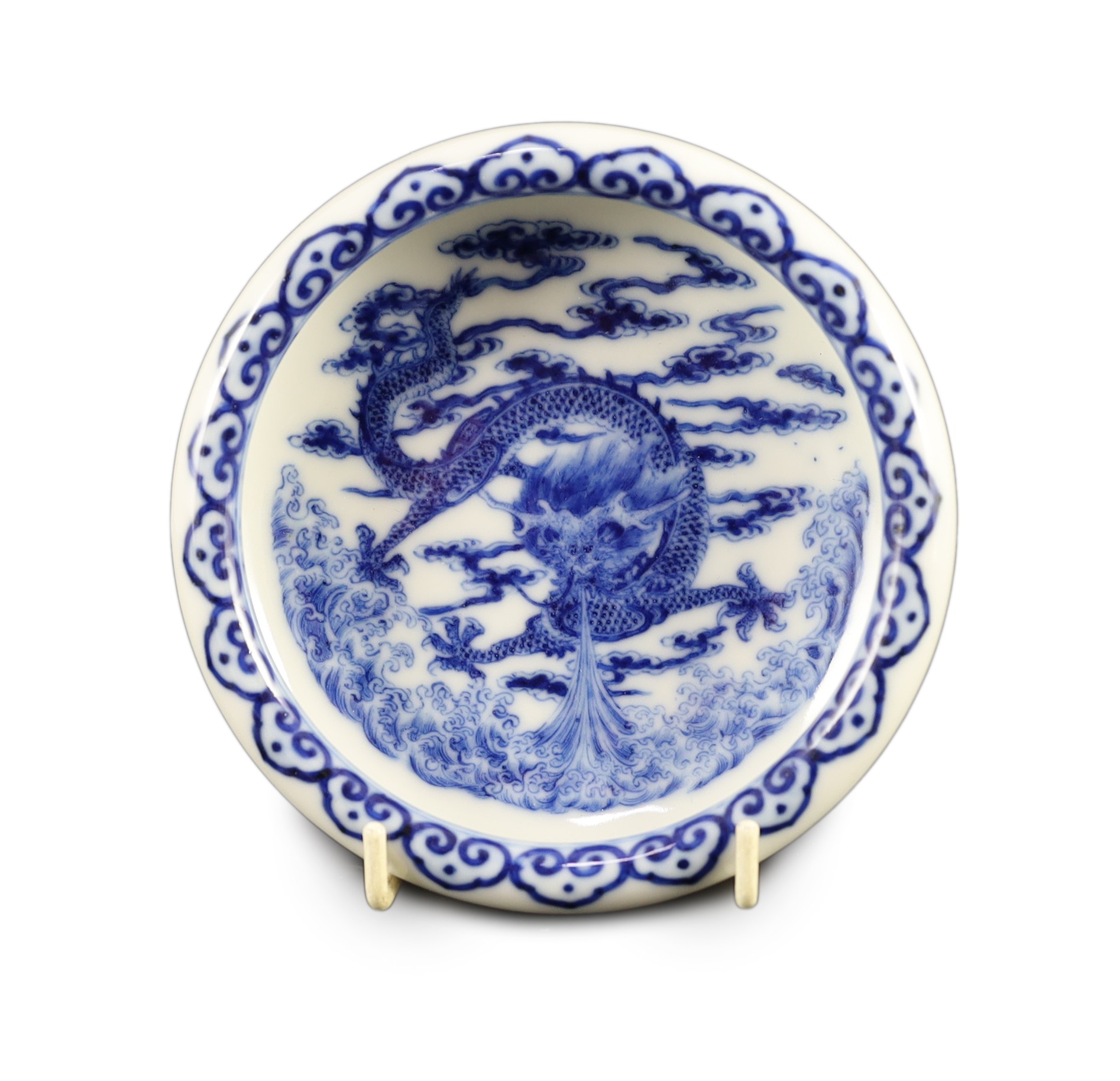 A Chinese blue and white 'dragon' brushwasher, Qianlong seal mark but Republic period, 13 cm diameter, wood stand and case